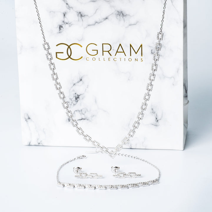 Alana necklace set, in front of its uniquely designed white box. 