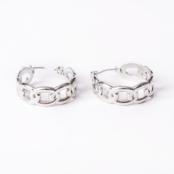 Alexandra Silver Earrings standing in the center of the image against a white background. 