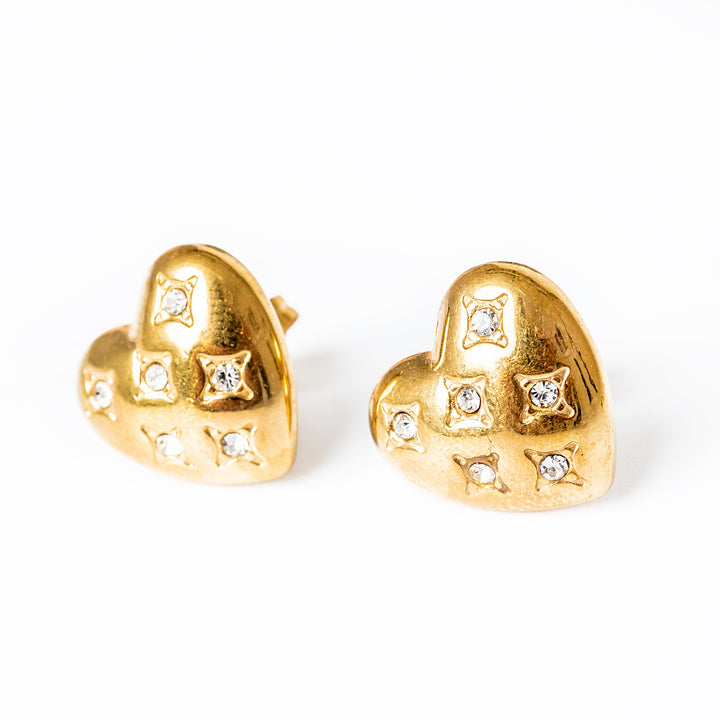 A close up view of Amanda Gold Earrings standing in the center of the image against a white background. 