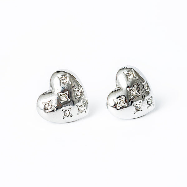 A close up view of Amanda Silver Earrings standing in the center of the image against a white background. 