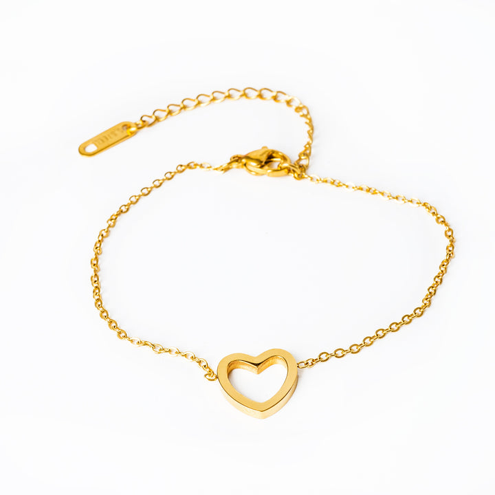 Amata Amata Gold Bracelet jewelry placed in the center of the image against a white background. 