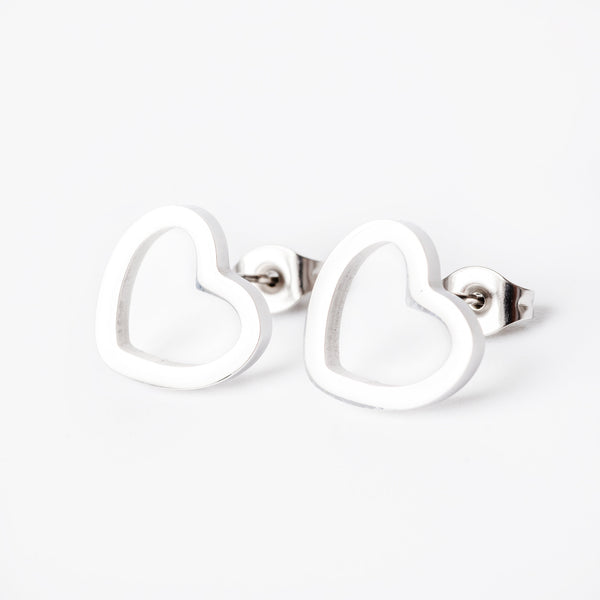 A close up view of Amata Silver Earrings standing in the center of the image against a white background. 
