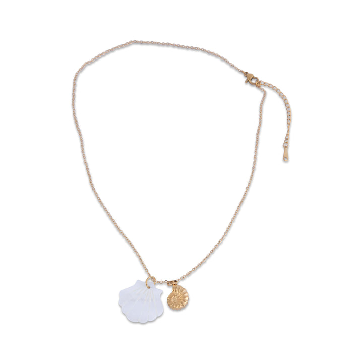 Gram Collection anchor bay necklace with a white pendant and gold accents on a white background from a bird view. 