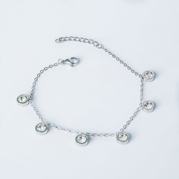 Silver Anita bracelet with round crystal charms displayed on a white background