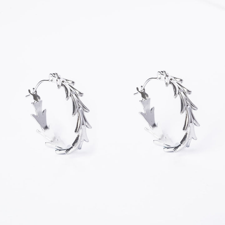 A close up view of Antonella Silver Earrings standing in the center of the image against a white background. 