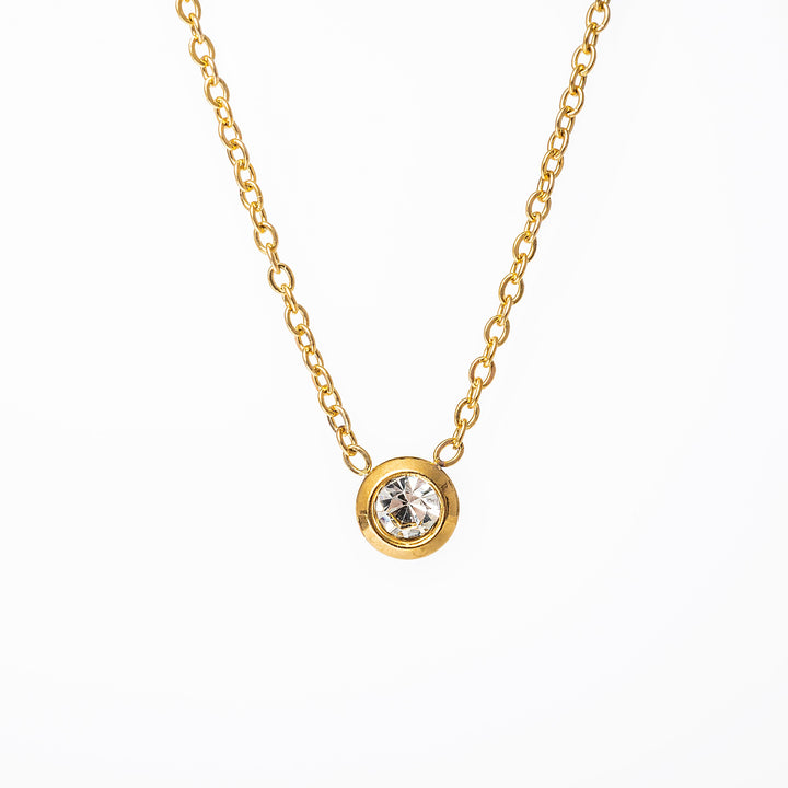 A close up view of Gabriella Gold Necklace standing in the center of the image against a white background. 