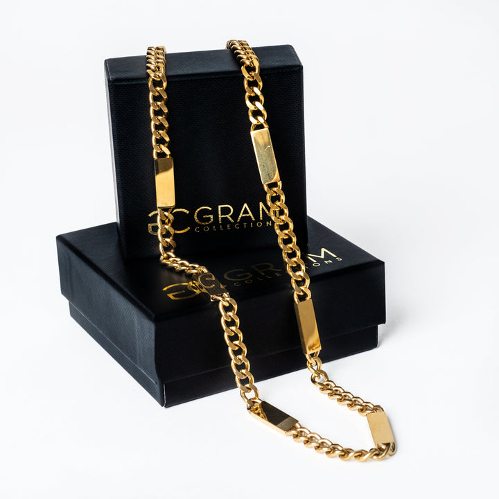 Bar Necklace Maltese style placed on its two uniquely designed black boxes. 