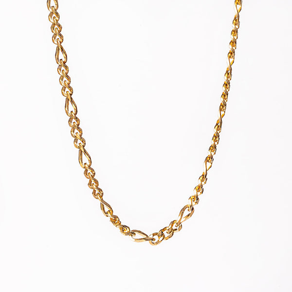 A yellow gold stainless steel necklace with a geometric pattern.