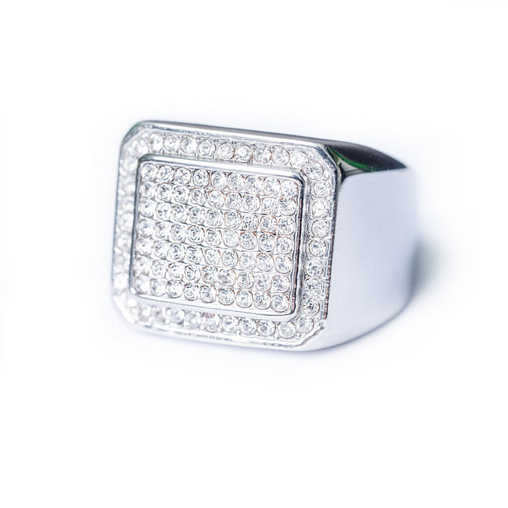 Silver Bobby Ring with a square pavé top set with clear round stones on a white background