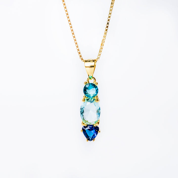 A close up view of briar set necklace standing in the center of the image against a white background. 