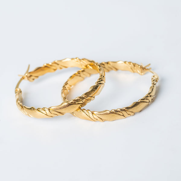 Carla gold hoop earrings with a twisted textured design