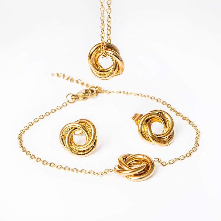 a close up view of carmen gold bracelet  set standing in 
