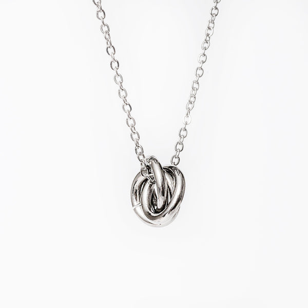 A carmen silver necklace standing in the center of the image against a white background 