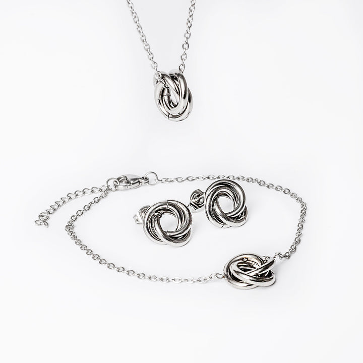 A carmenn silver set close up view, standing in the center of the image against a white background 