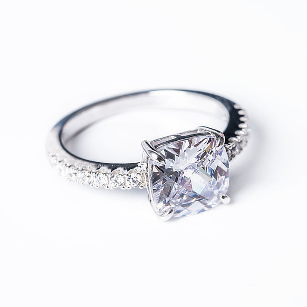 A close up view of Cassia Ring standing against a white background. 