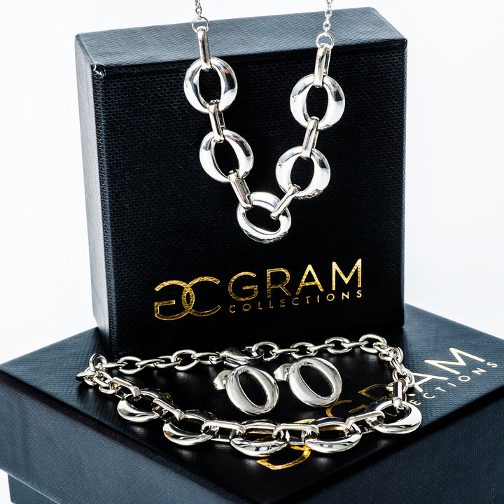 Chantelle Silver Necklace standing on its box. 