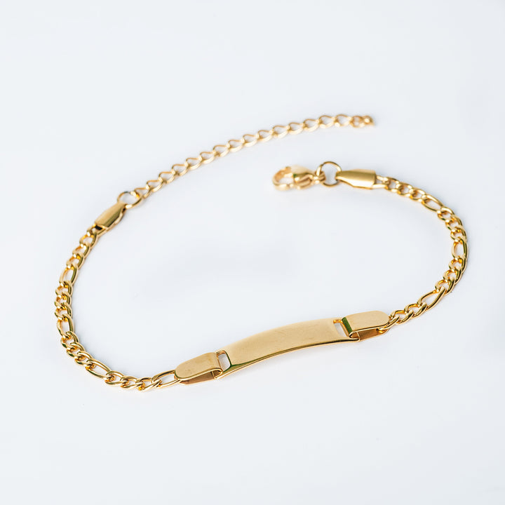 Gold Claudio Bracelet with a polished ID plate shown in an angled view