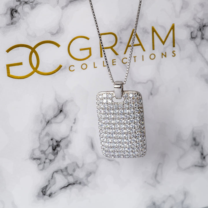 Close up view of Clementis necklace against its silver box. 