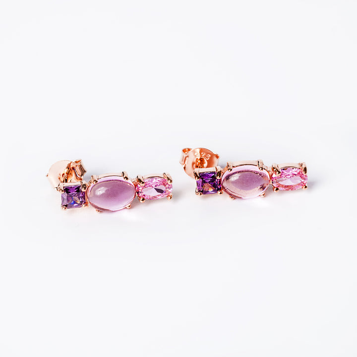 A cody set earrings standing in the center of the image against a white background. 