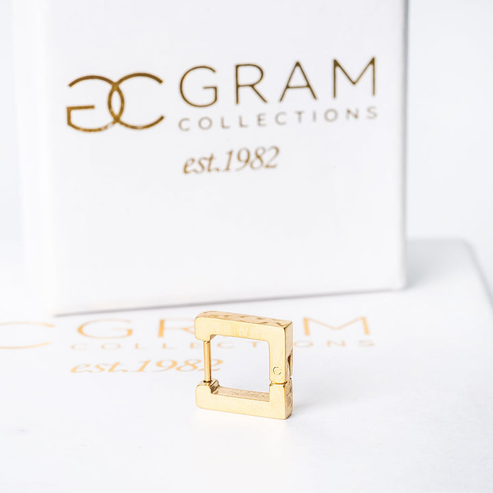 A connor earrings on a white box.
