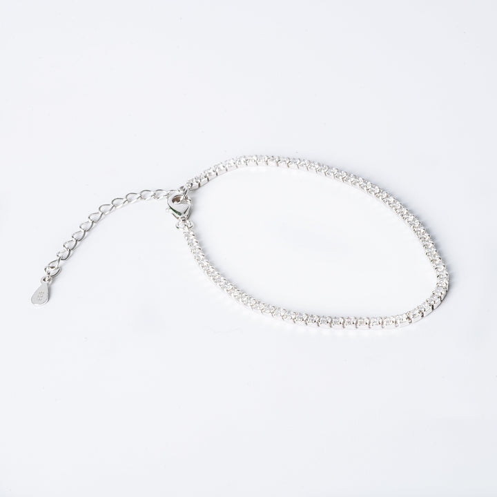 Cora bracelet with hypoallergenic cubic zirconia embellishments, featuring a chain structure and a lobster clasp closure.