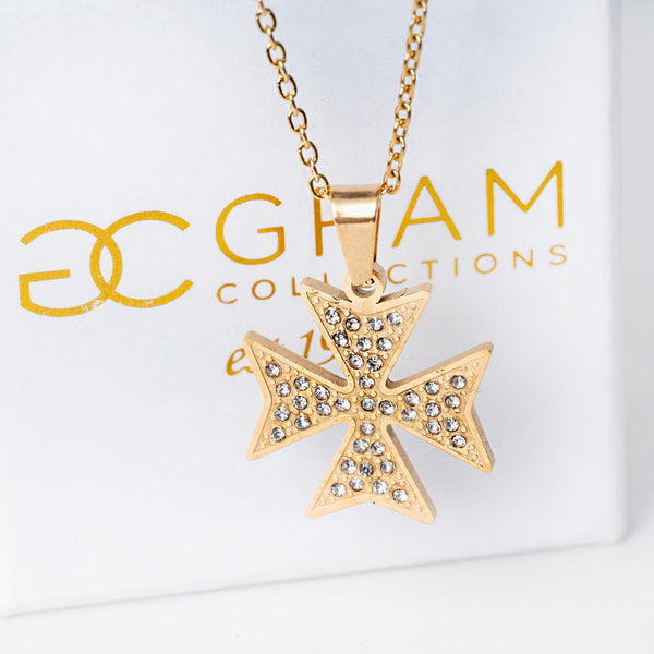 A gold-plated stainless steel cross necklace with a yellow gold chain and a pendant featuring cubic zirconia embellishments.