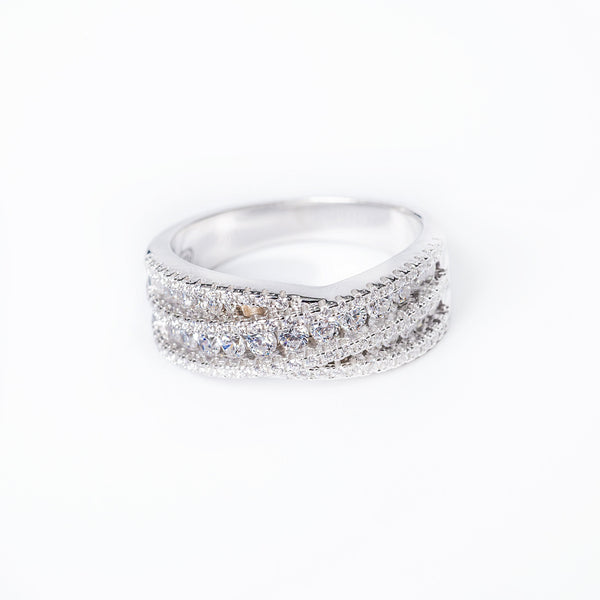 a close up view of a cynthia ring, standing in the center of the image, against a white background. 