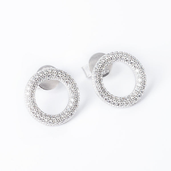 A close up view of Dalphine earrings standing against a white background. 