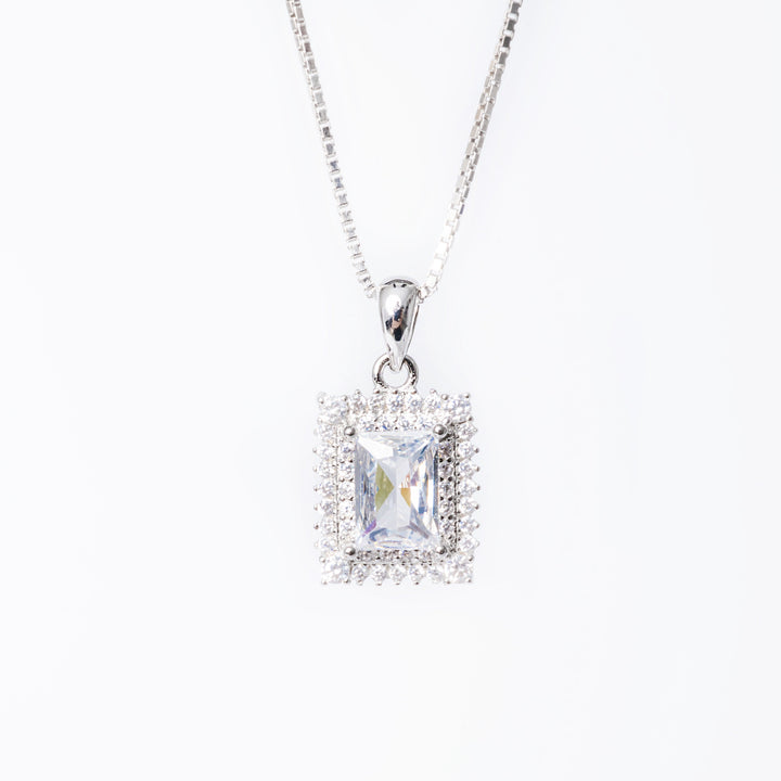 A close up view of Daphne necklace standing against a white background. 