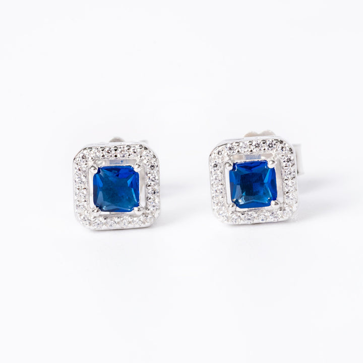 An edith earrings in blue stone colour standing in the center of the image against a white background. 