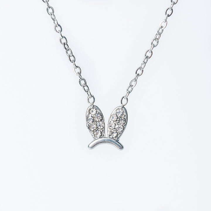 Silver Elena necklace with a crystal-studded bunny-shaped pendant.