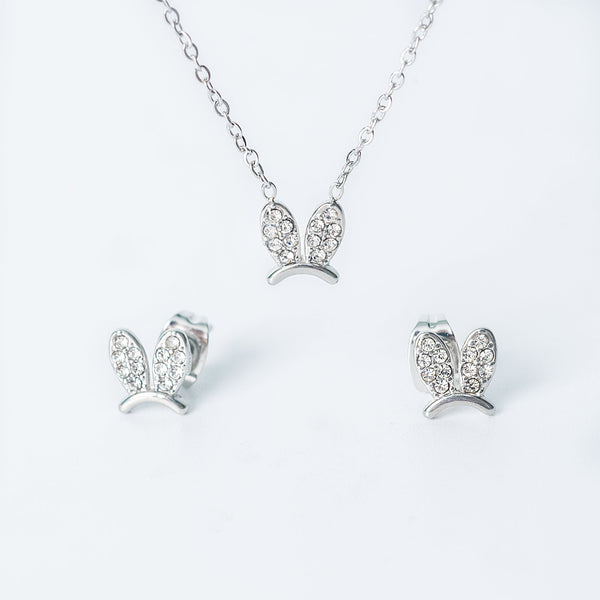 Silver Elena jewelry set featuring a necklace and matching earrings with crystal-studded bunny-shaped designs.