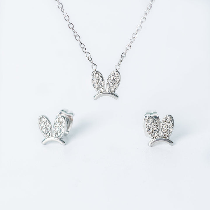 Silver Elena jewelry set featuring a necklace and matching earrings with crystal-studded bunny-shaped designs.