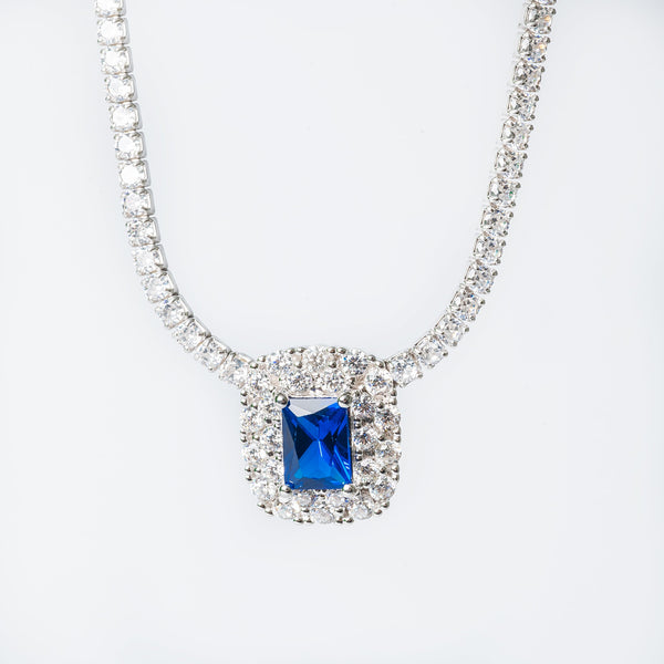 A sterling silver Elizabeth necklace featuring a blue and white cubic zirconia pendant surrounded by silver beads.