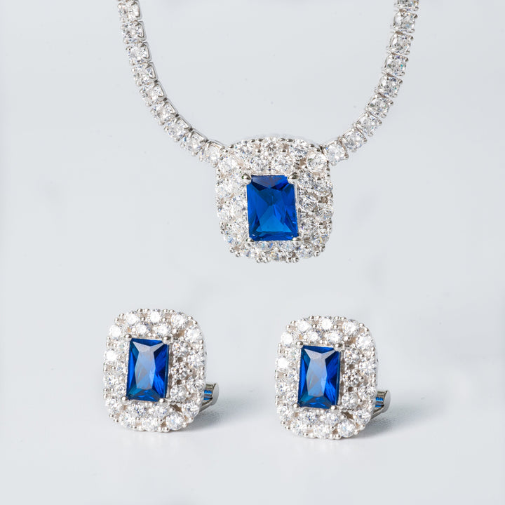 The Elizabeth necklace and its two pendants against white background 