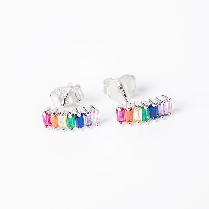 A close up view of ella earrings standing against a white background 