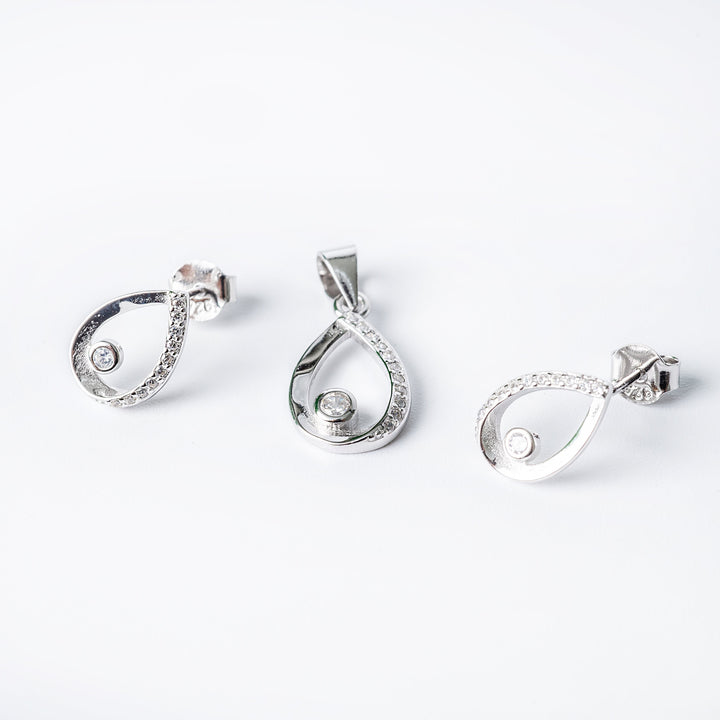 A set of sterling silver Emma set jewelry including a pendant, chain, and earrings, adorned with cubic zirconia.