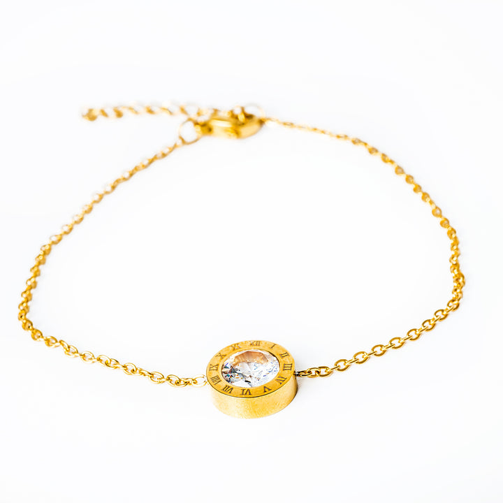 Easter gold bracelet standing in the center of the image against a white background. 