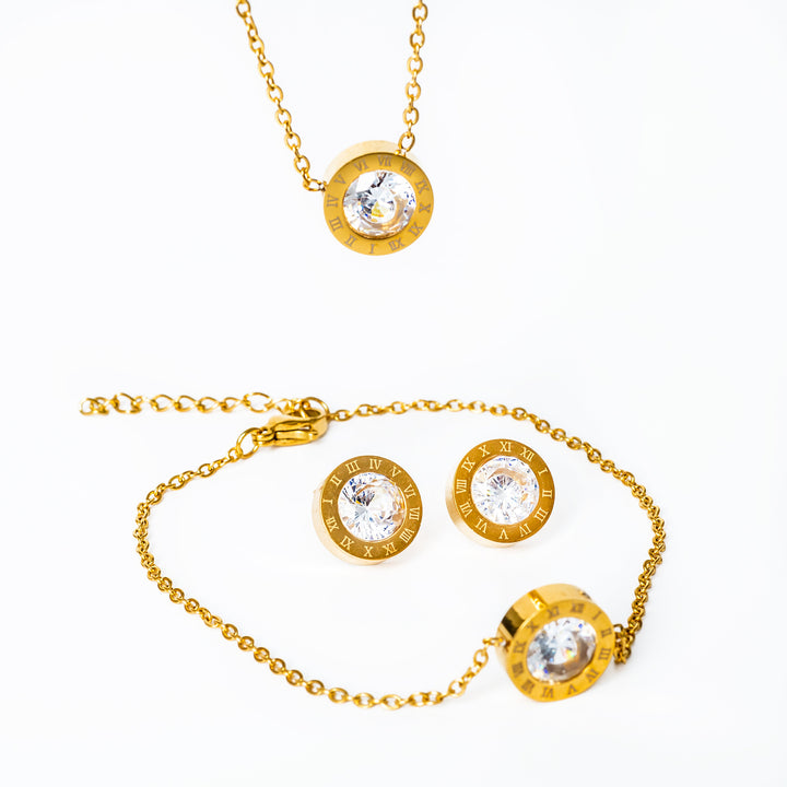 A easter gold necklace set standing in the center of the image against a white background. 