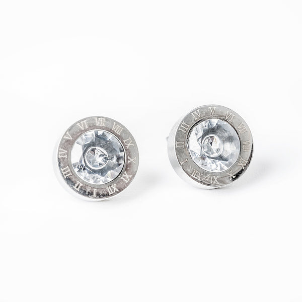 A pair of  Easter silver gram collections earrings with cubic zirconia accents, featuring a textured surface and a shiny central area.