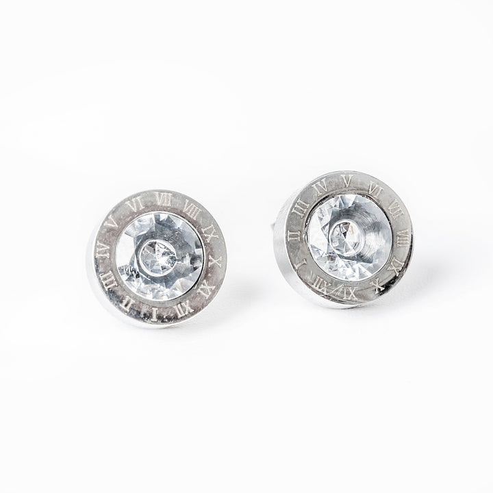 A pair of  Easter silver gram collections earrings with cubic zirconia accents, featuring a textured surface and a shiny central area.