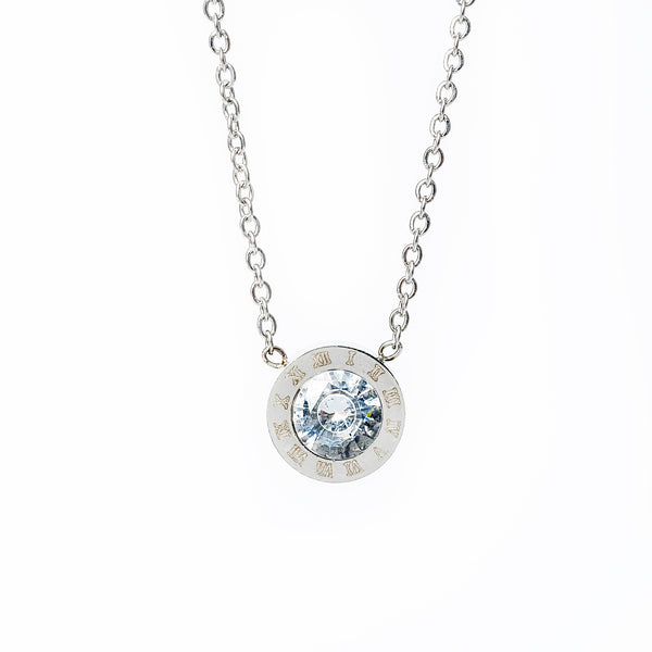 An Easter silver necklace with a gold plated stainless steel chain and a central cubic zirconia pendant.