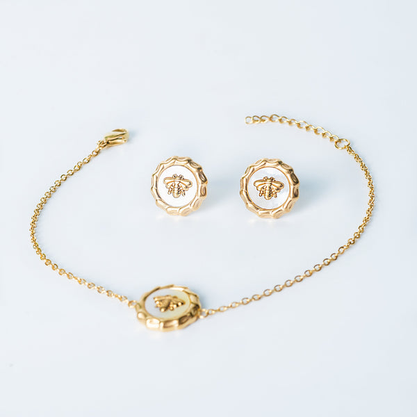 Gold Evelyn set with bee bracelet and matching bee earrings displayed on a white background