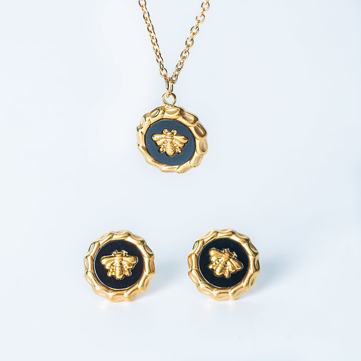 Gold Evelyn set with bee necklace and matching bee earrings on a white background