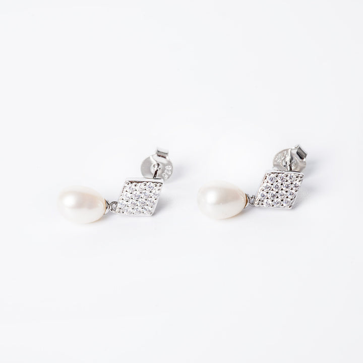 A pair of Federica silver earrings featuring a pattern of cultured pearls and cubic zirconia, with a metallic and glass finish.