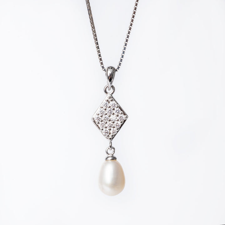 A silver Federica necklace featuring a square pendant with a cubic zirconia and cultured pearl design.