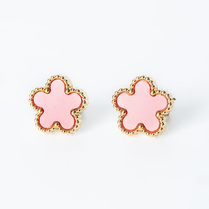 Gold Fiore stud earrings shown as a pair with bright pink flower-shaped fronts on a white background
