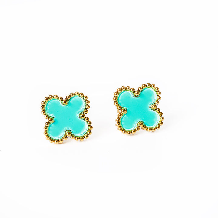 a close up view of Fiore Earrings  in purle-blue colour standing in the center of the image against a whte background. 