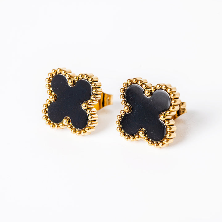 An close up view of Fiore Earrings  in black colour standing in the center of the image against a white background. 