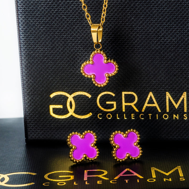 Fiore Earrings  standing in the center of the image in front of its box. 